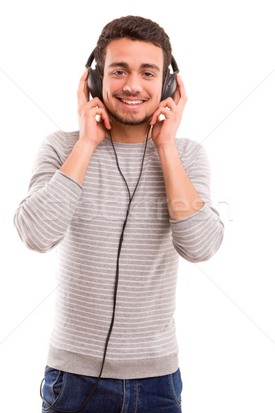 Człowiek słuchanie muzyki szczęśliwy młody człowiek słuchawki muzyki Zdjęcia stock © hsfelix
