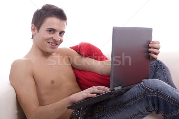 Foto stock: Trabalhando · laptop · sofá · homem · feliz