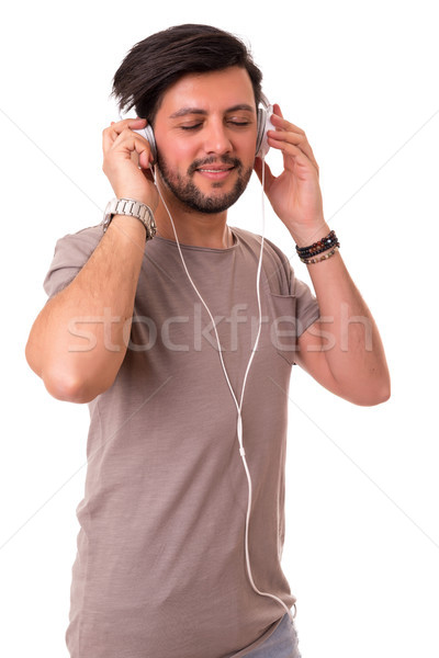 Hombre escuchar música feliz joven auriculares música Foto stock © hsfelix