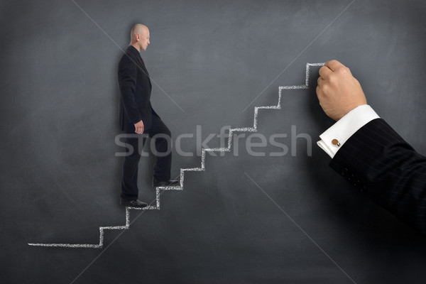 Helpende hand groei zakenman helpen donkere manager Stockfoto © hyrons