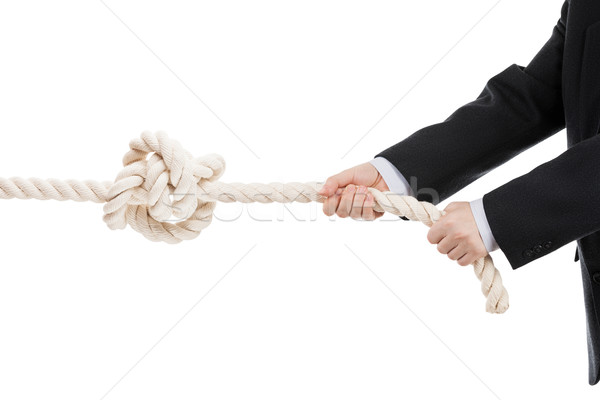 Business man hand holding or pulling rope with tied knot Stock photo © ia_64