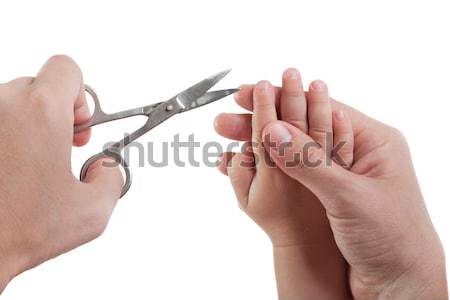 Schneiden Kind Fingernagel menschlichen Hand halten Schere Stock foto © ia_64
