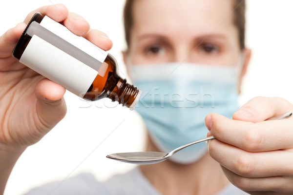 Doctor in mask holding medicine syrup Stock photo © ia_64