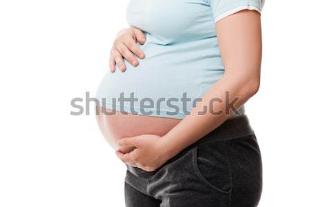 Kobieta w ciąży dotknąć klejenie brzuch ciąży Zdjęcia stock © ia_64