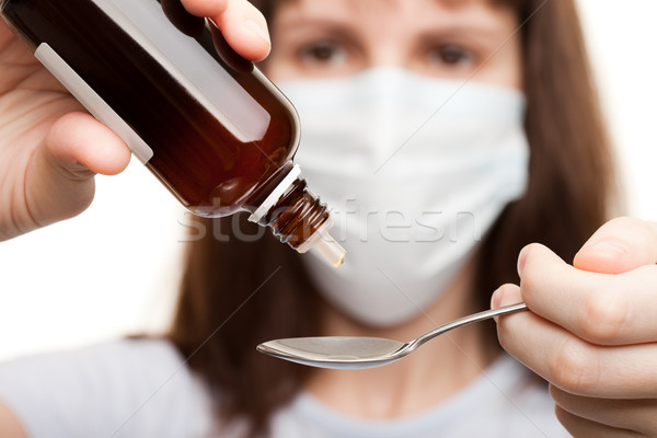 Doctor in mask holding medicine syrup Stock photo © ia_64