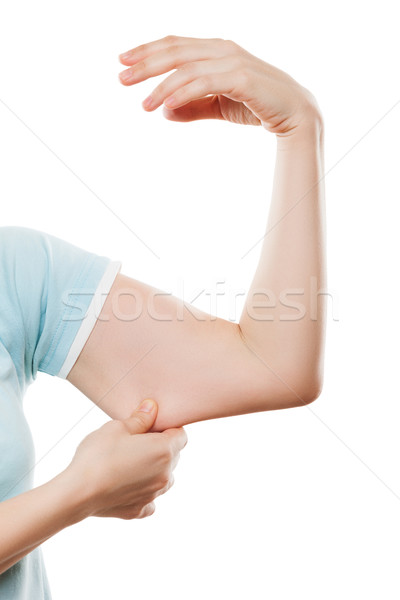 Overweight woman hand holding or pinching weak flabby triceps mu Stock photo © ia_64
