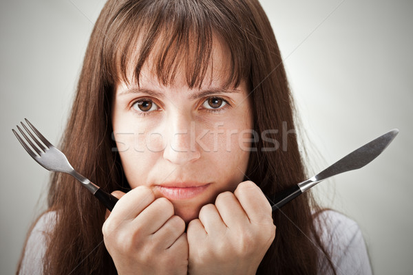 Stock photo: Women hand holding fork and knife