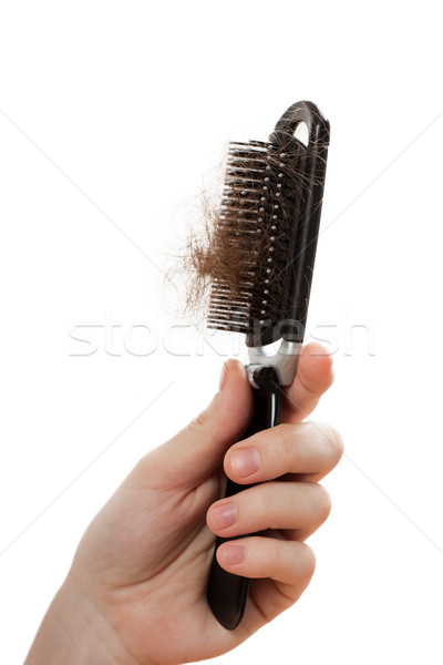 Stock photo: Loss hair comb in women hand