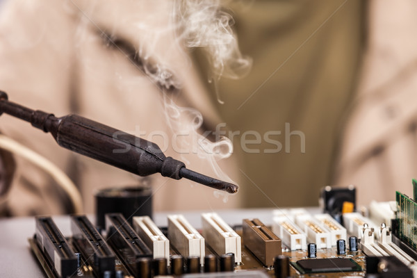 человеческая рука пайка железной компьютер Сток-фото © ia_64