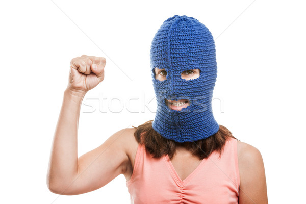 Woman in balaclava showing raised fist gesture Stock photo © ia_64