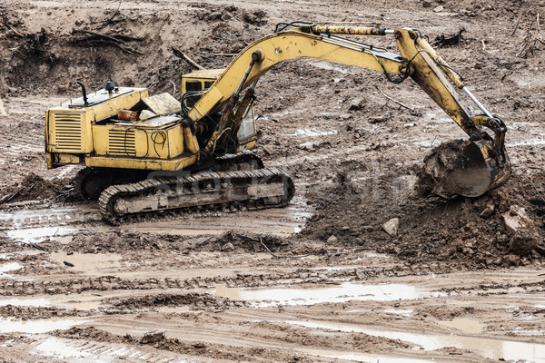 Digging excavator machine at building construction site Stock photo © ia_64