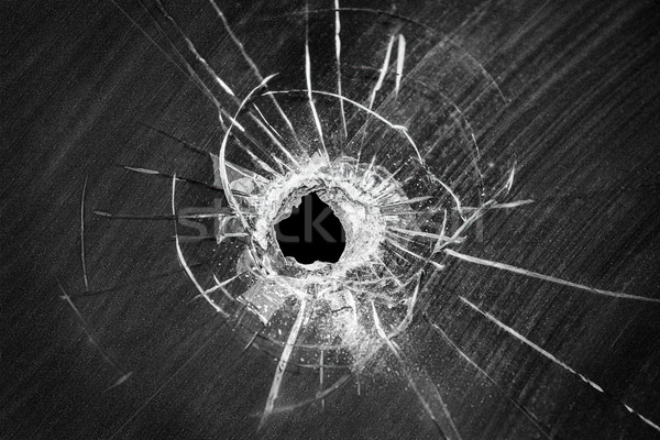Bullet shot cracked hole on broken window glass Stock photo © ia_64