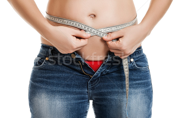 Nadwaga kobieta dżinsy tłuszczu Zdjęcia stock © ia_64