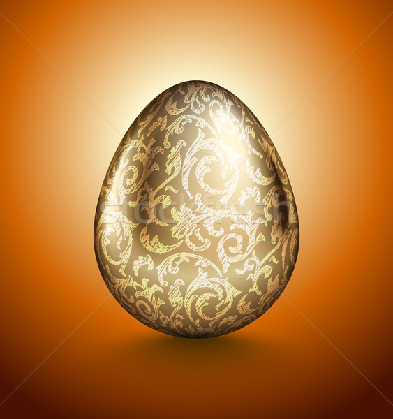 Glossy realistic golden egg with light handdrawn floral pattern. Isolated on orange background Stock photo © Iaroslava