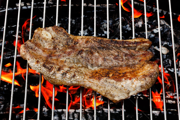 Fried meat slice on barbecue grid Stock photo © icefront