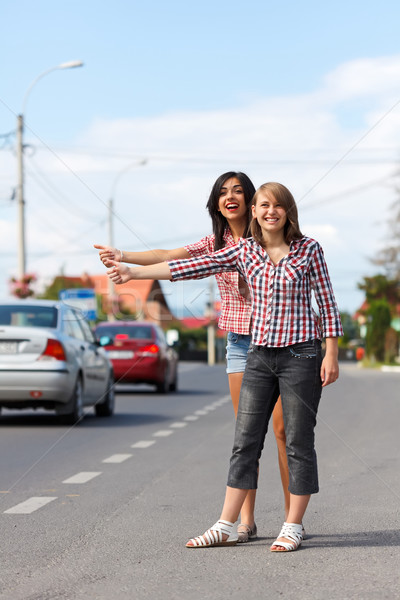 Girls hitch-hiking Stock photo © icefront