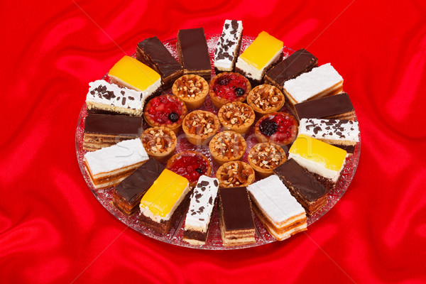 Various sweet cakes on round plate Stock photo © icefront