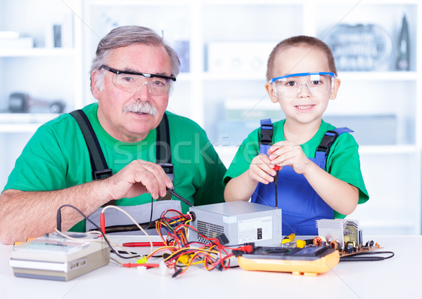 Grandchild disassembling PC power supply Stock photo © icefront