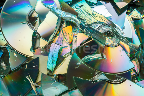 Data destruction: broken CD and DVD disks Stock photo © icefront