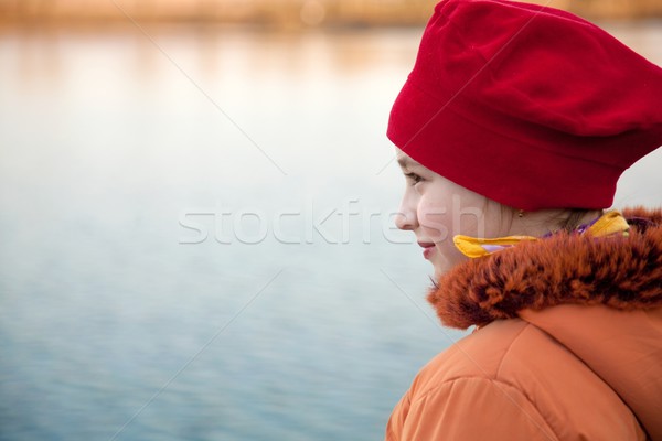Girl on lakeside Stock photo © icefront