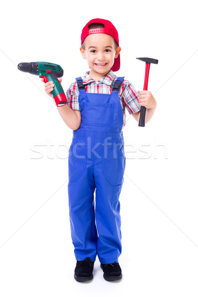 Little handyman with drill and hammer Stock photo © icefront