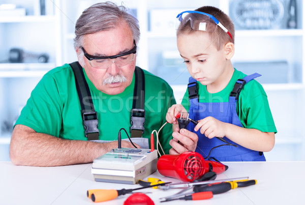 Grandfather and grandchild using multimeter Stock photo © icefront