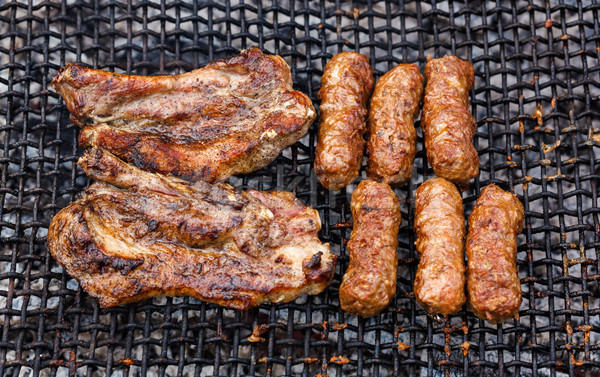 Grilled Romanian meat slices and rolls - mititei, mici Stock photo © icefront