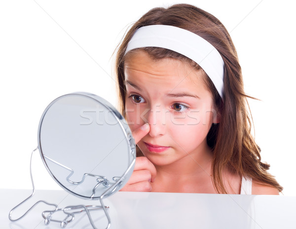 Girl searching for pimples Stock photo © icefront