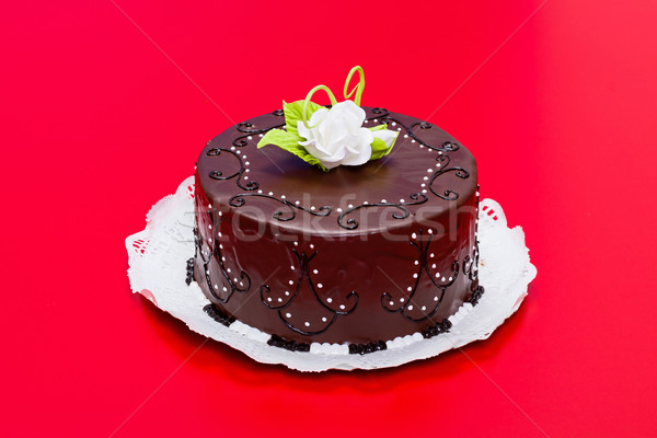 Chocolate cake with white candy rose decoration Stock photo © icefront