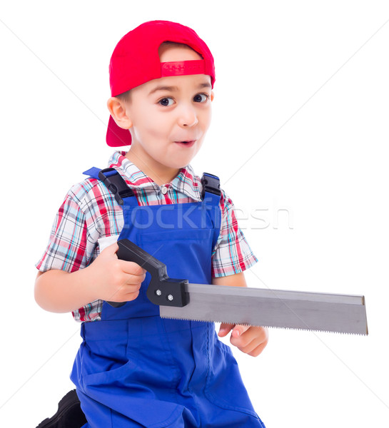 Little handyman showing saw cutting hazard Stock photo © icefront