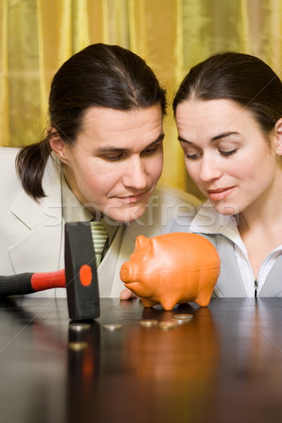 Pénzkeresés pár néz pénz persely férfiak Stock fotó © icefront
