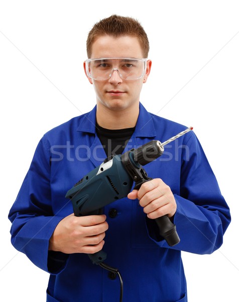 Young worker holding drilling machine Stock photo © icefront