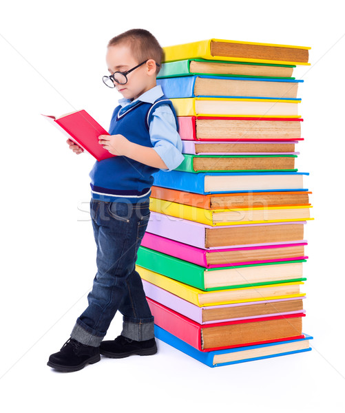Little boy reading near big stack of books Stock photo © icefront