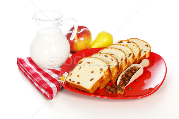 Slices of sweet loaf with raisins and milk Stock photo © icefront