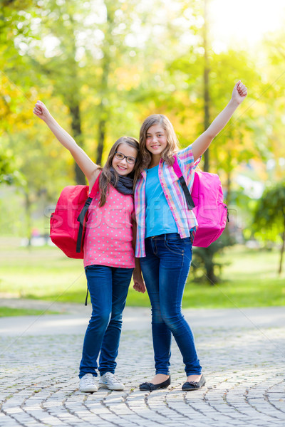 Happy teenage schoolgirls with schoolbag Stock photo © icefront