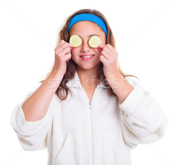 Girl with cucumber slices over her eyes Stock photo © icefront