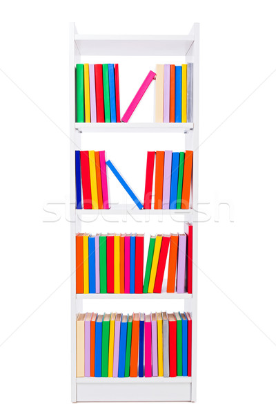 Keskeny könyvespolc fehér polc tele színes Stock fotó © icefront