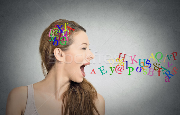 woman talking, alphabet letters in her head and coming out of mouth Stock photo © ichiosea