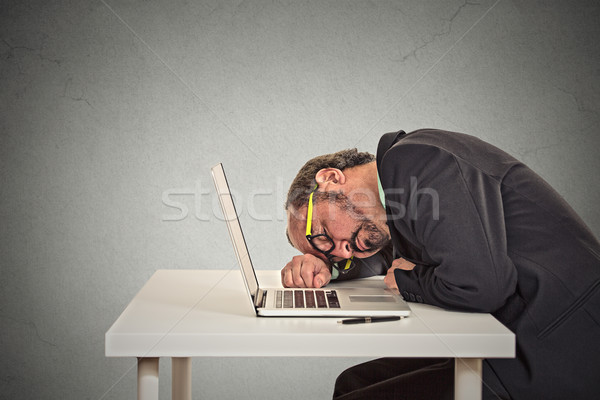 Stock photo: Businessman sleeping on a laptop