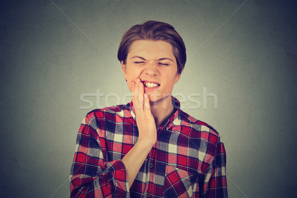 young man with a toothache tooth pain Stock photo © ichiosea