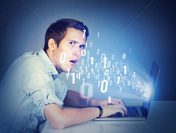 Surprised perplexed man with laptop learning computer science   Stock photo © ichiosea