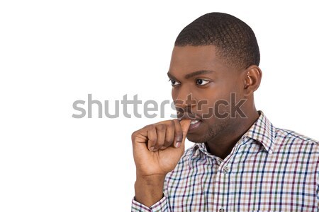 Stock photo: Thinking man with finger in mouth, sucking thumb