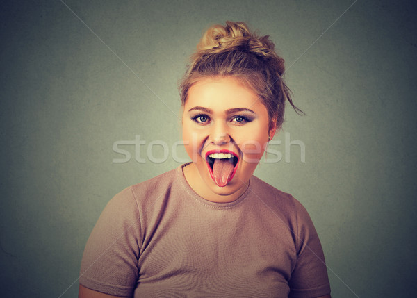woman sticking out her tongue. Negative human emotion facial expression feeling
 Stock photo © ichiosea