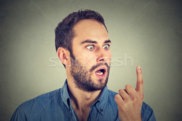 Shocked man looking at his finger  Stock photo © ichiosea