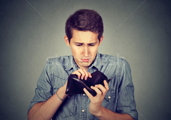 Man with no money. Businessman holding empty wallet Stock photo © ichiosea
