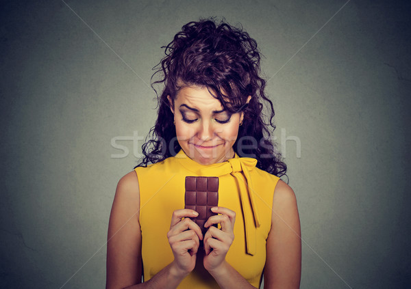 sad woman tired of diet restrictions craving sweets chocolate bar  Stock photo © ichiosea