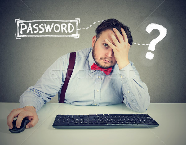 Desperate man trying to log into his computer forgot password   Stock photo © ichiosea
