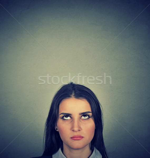 Jungen skeptisch Frau nachschlagen isoliert grau Stock foto © ichiosea