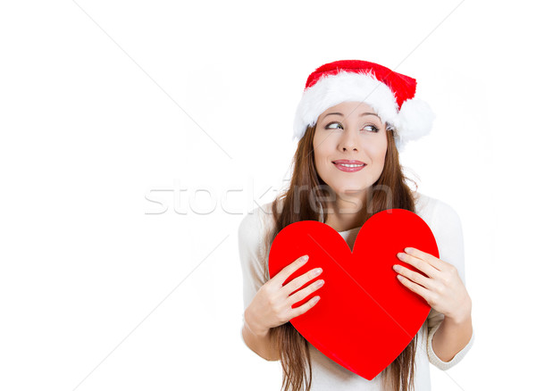 Beautiful, adorable christmas woman in love, holding a big heart Stock photo © ichiosea