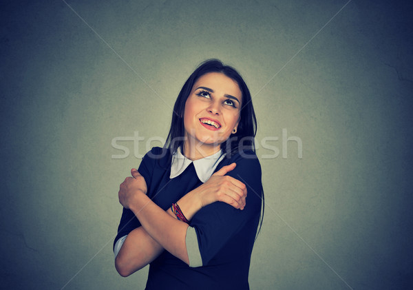 smiling woman holding hugging herself Stock photo © ichiosea